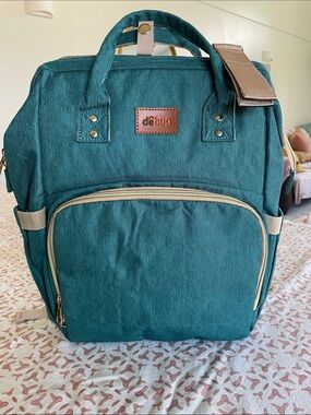 DEBUG Convertable Diaper Bag With Portable Changing Table. Teal color.